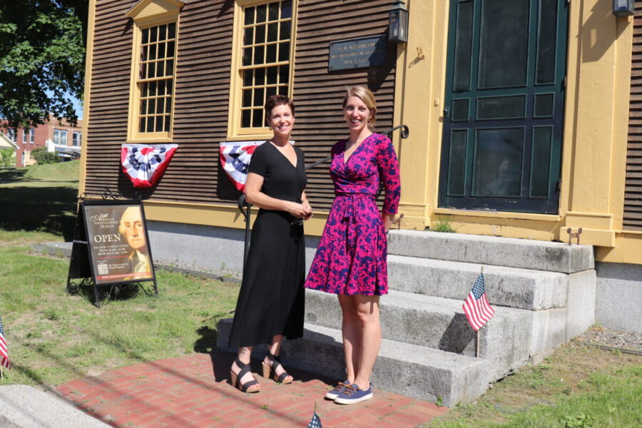 Riverwoods Exeter and AIM representatives standing in front of the Folsom Tavern